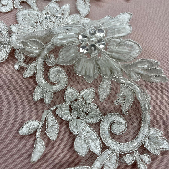 Beaded & Corded Silver Floral Appliqué Lace Embroidered on 100% Polyester Organza or Net Mesh. This can be applied to Theatrical dance ballroom costumes, bridal dresses, bridal headbands endless possibilities. Sold By Pair. Lace Usa