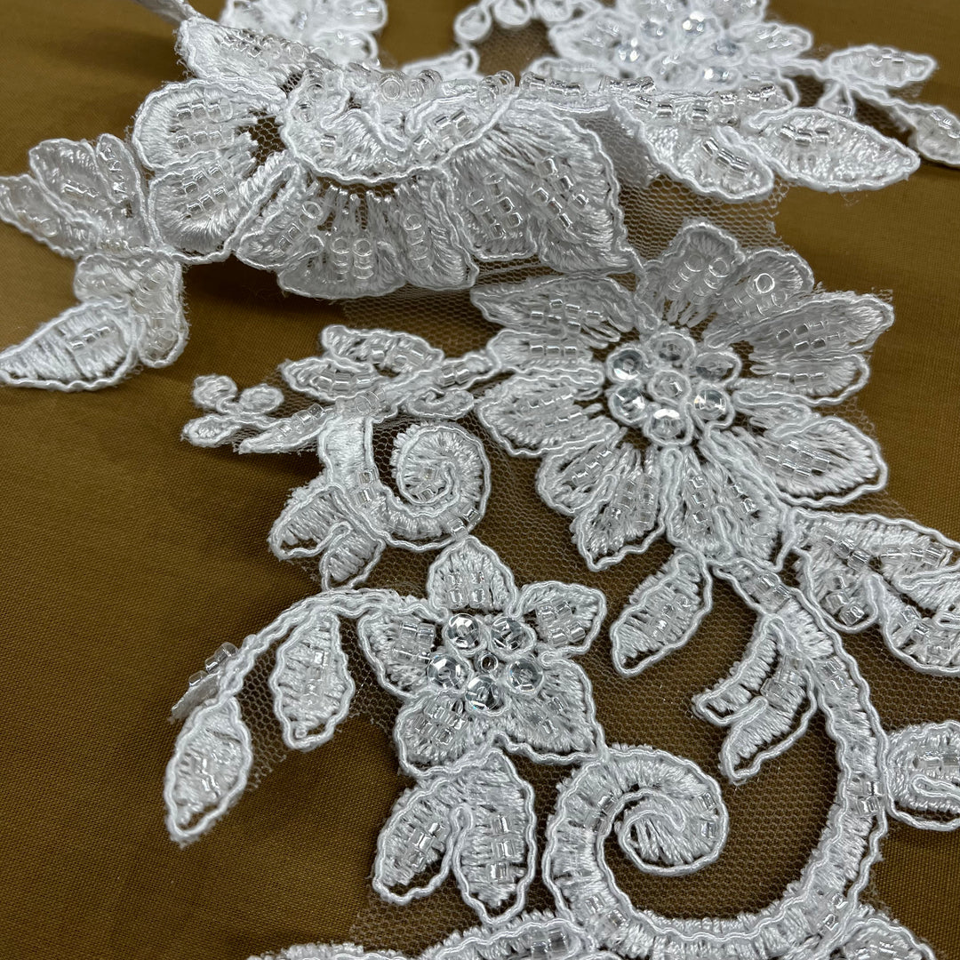 Beaded & Corded Silver Floral Appliqué Lace Embroidered on 100% Polyester Organza or Net Mesh. This can be applied to Theatrical dance ballroom costumes, bridal dresses, bridal headbands endless possibilities. Sold By Pair. Lace Usa