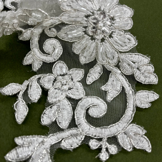 Beaded & Corded Silver Floral Appliqué Lace Embroidered on 100% Polyester Organza or Net Mesh. This can be applied to Theatrical dance ballroom costumes, bridal dresses, bridal headbands endless possibilities. Sold By Pair. Lace Usa