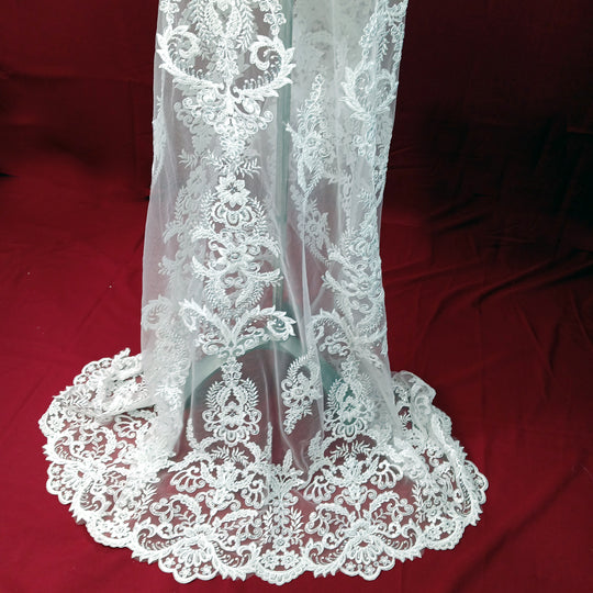 Corded & Beaded Bridal Lace Fabric Embroidered on 100% Polyester Net Mesh.  Sold the yard.  Lace Usa