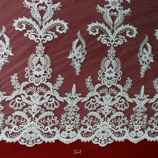 Corded & Beaded Bridal Lace Fabric Embroidered on 100% Polyester Net Mesh.  Sold the yard.  Lace Usa