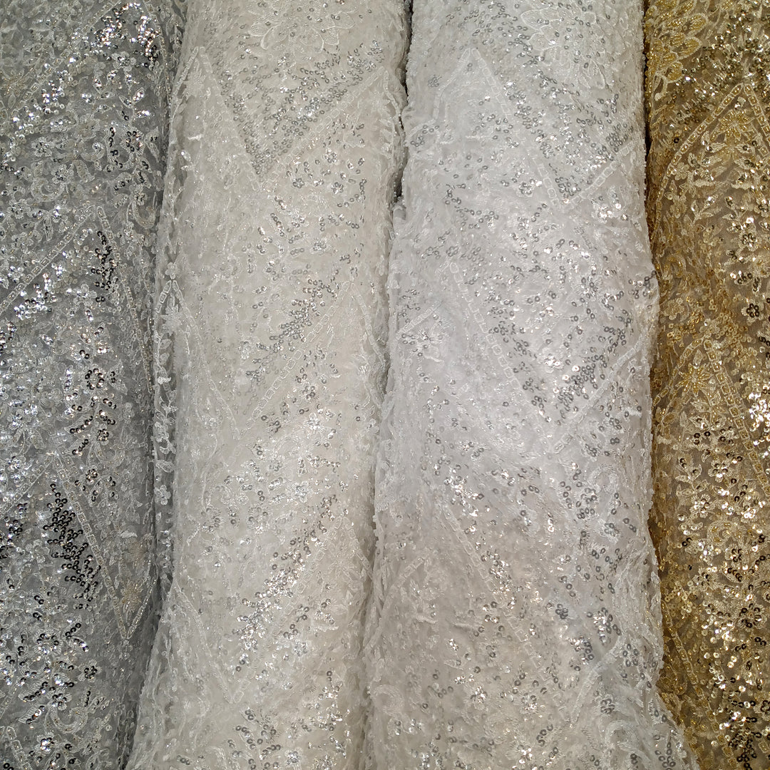 Embroidered & Heavily Beaded with Beads & sequin on Net Mesh Fabric.  Sold by the yard.  Lace Usa