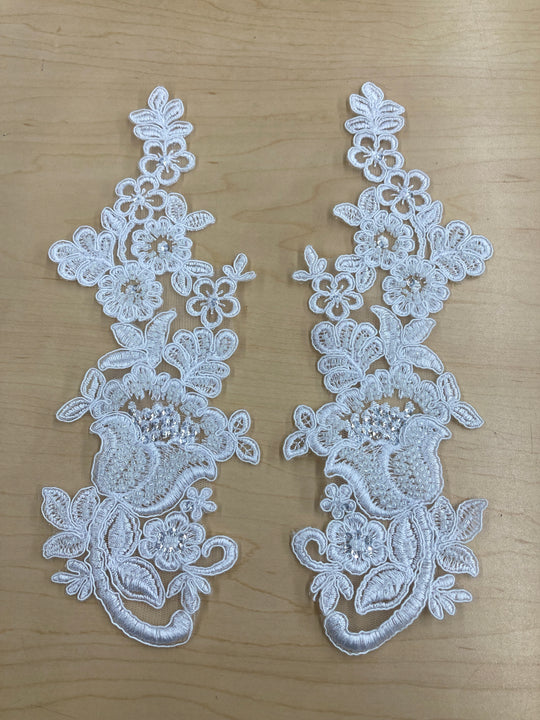 Beaded & Corded Floral White Appliqué Lace Embroidered on 100% Polyester Mesh Net. This can be applied to lyrical dance ballroom costumes, bridal dresses, bridal headbands endless possibilities.  Sold By Pair  Lace Usa